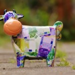 banknote-cow-on-gray-conncrete-road-164627