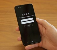 1625757174157-anom-hand