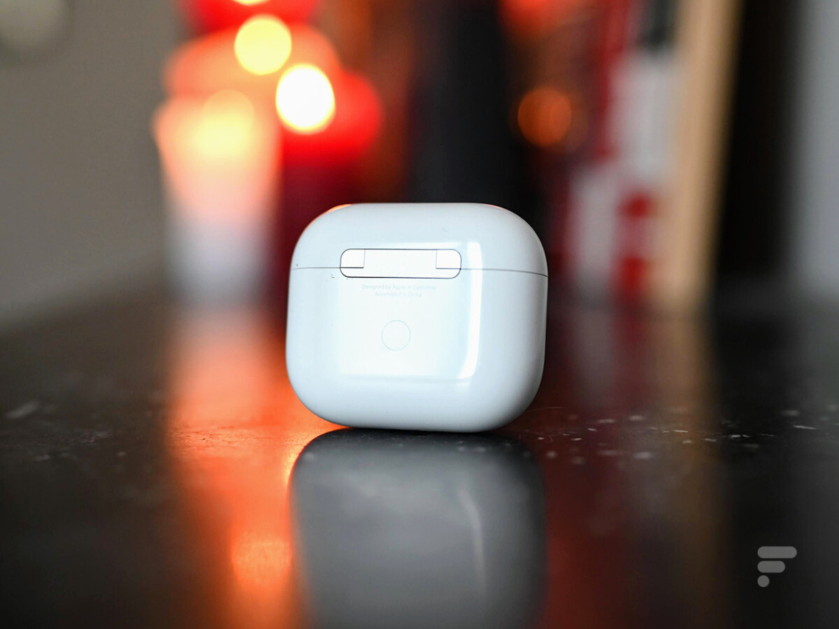 The pairing button on the back of the Apple AirPods 3 case
