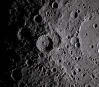 art002e009282 (April 6, 2026) - A close-up view taken by the Artemis II crew of Vavilov Crater on the rim of the older and larger Hertzsprung basin. The right portion of the image shows the transition from smooth material within an inner ring of mountains to more rugged terrain around the rim. Vavilov and other craters and their ejecta are accentuated by long shadows at the terminator, the boundary between lunar day and night. The image was captured with a handheld camera at a focal length of 400 mm, as the crew flew around the far side of the Moon.