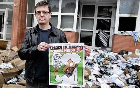 Luz, le dessinateur de Charlie Hebdo, sa couv' et les décombres
