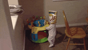 Toddler wearing a cereal box - compress