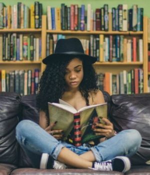 girl reading seven shooter unsplash