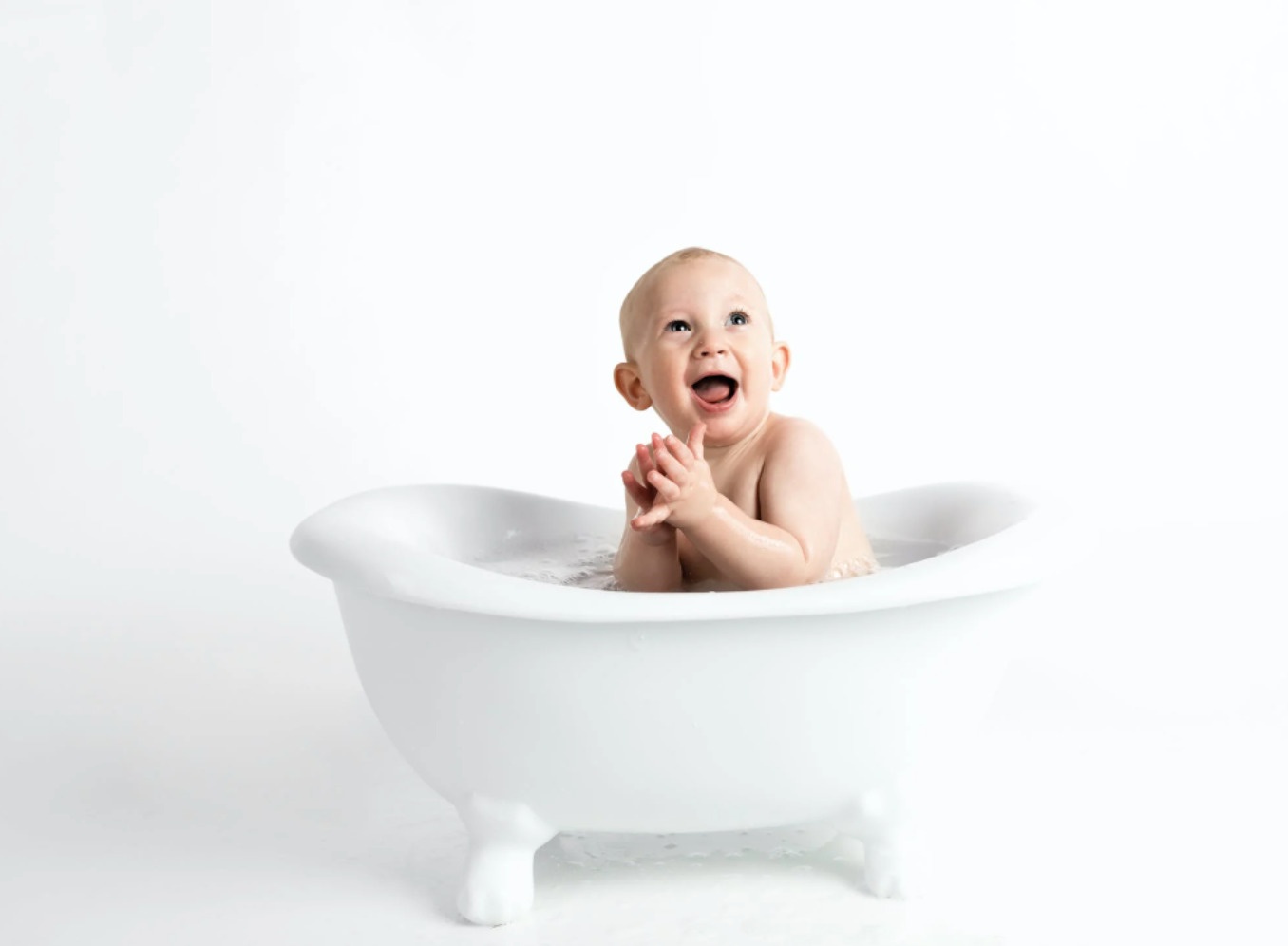 This baby seems happy to have a tub his size.  Photo credit: Henley Design Studio / Pexels