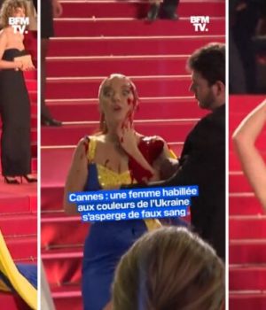 Une femme dans une robe aux couleurs du drapeau de l'Ukraine se recouvre de faux sang sur le tapis rouge du festival de Cannes 2023 // Source : Capture d'écran Twitter de BFM TV