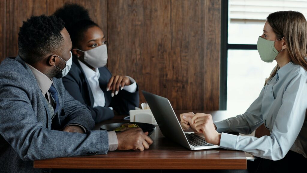 business-people-wearing-face-masks-and-talking-4427926