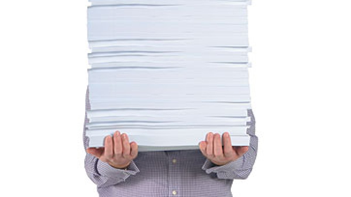 man-with-pile-of-paper1.jpg