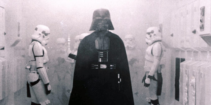 In this 1977 image provided by 20th Century-Fox Film Corporation, Darth Vader, played by David Prowse and voiced by James Earl Jones, and his Imperial stormtroopers take over the Rebel Blockade Runner in a scene from "Star Wars." The intergalactic adventure launched in theaters 35 years ago on May 25, 1977, introducing the world to The Force, Luke Skywalker, Darth Vader, Princess Leia, Han Solo and a pair of loveable droids named R2-D2 and C-3PO. (AP Photo/20th Century-Fox Film Corporation)