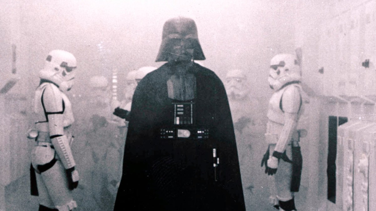 In this 1977 image provided by 20th Century-Fox Film Corporation, Darth Vader, played by David Prowse and voiced by James Earl Jones, and his Imperial stormtroopers take over the Rebel Blockade Runner in a scene from "Star Wars." The intergalactic adventure launched in theaters 35 years ago on May 25, 1977, introducing the world to The Force, Luke Skywalker, Darth Vader, Princess Leia, Han Solo and a pair of loveable droids named R2-D2 and C-3PO. (AP Photo/20th Century-Fox Film Corporation)