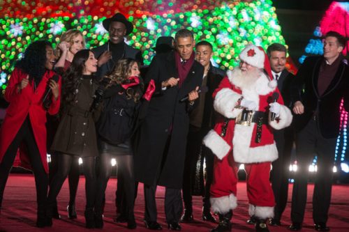 President Barack Obama dances on stage with Fifth Harmony during the singing of “Jingle Bells” during the National Christmas Tree lighting on the Ellipse in Washington, D.C., Dec. 4, 2014. (Official White House Photo by Lawrence Jackson)