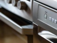 Metallic stove and dishwasher in the kitchen