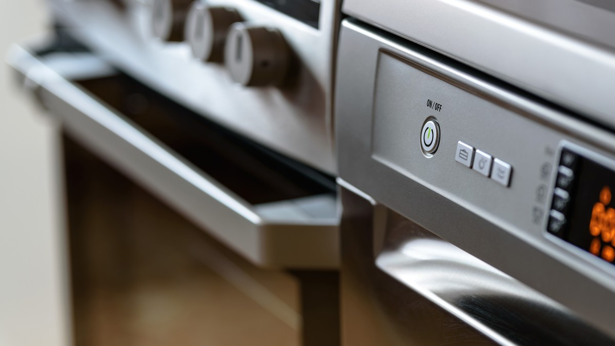 Metallic stove and dishwasher in the kitchen