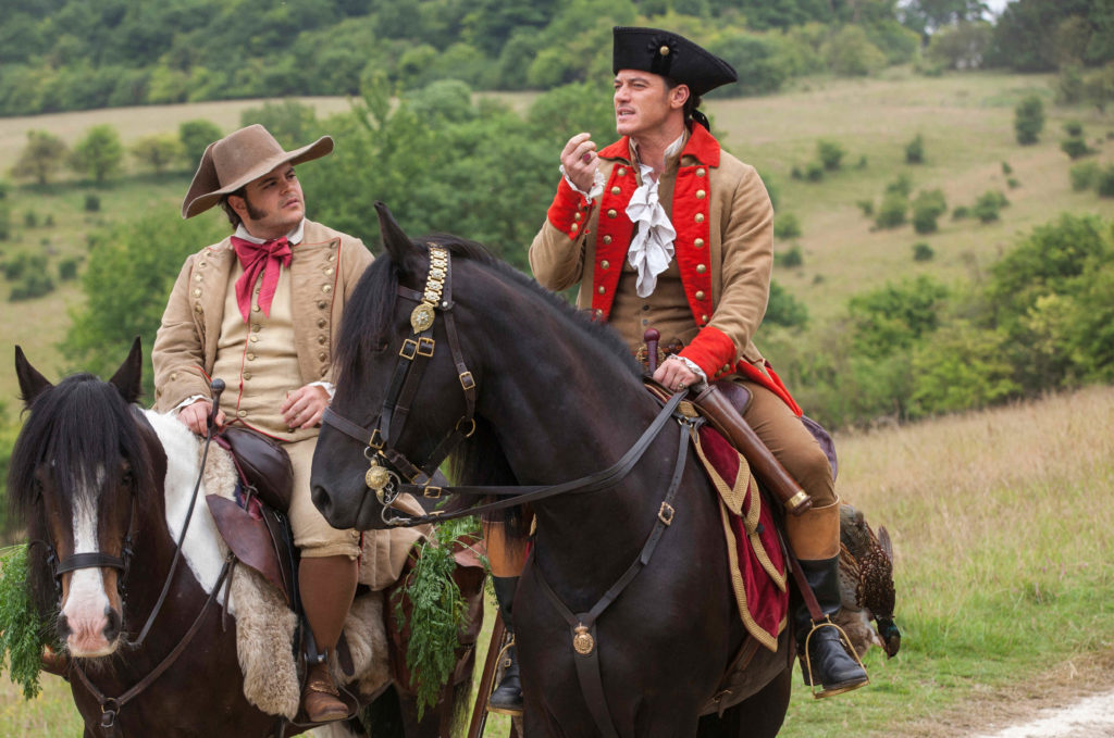 Luke Evans stars as Gaston and Josh Gad as Le Fou in Disney's BEAUTY AND THE BEAST, a live-action adaptation of the studio's animated classic directed by Bill Condon which brings the story and characters audiences know and love to life. Luke Evans stars as Gaston and Josh Gad as Le Fou in Disney's BEAUTY AND THE BEAST, a live-action adaptation of the studio's animated classic directed by Bill Condon which brings the story and characters audiences know and love to life.