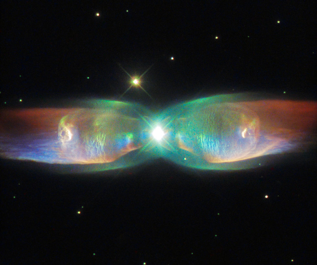 The Twin Jet Nebula, or PN M2-9, is a striking example of a bipolar planetary nebula. Bipolar planetary nebulae are formed when the central object is not a single star, but a binary system, Studies have shown that the nebula’s size increases with time, and measurements of this rate of increase suggest that the stellar outburst that formed the lobes occurred just 1200 years ago. The Twin Jet Nebula, or PN M2-9, is a striking example of a bipolar planetary nebula. Bipolar planetary nebulae are formed when the central object is not a single star, but a binary system, Studies have shown that the nebula’s size increases with time, and measurements of this rate of increase suggest that the stellar outburst that formed the lobes occurred just 1200 years ago.