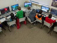Sixth-graders at Dzantik'i Heeni Middle School work on the Mindcraft mazes during their technology class in Juneau, Alaska, on Friday, March 6, 2015.  Rather than fight the electronic glue, some educators are embracing children tech-obsession and finding ways to incorporate computer games into the classroom. None has been more popular than Minecraft. (AP Photo/The Juneau Empire, Michael Penn )
