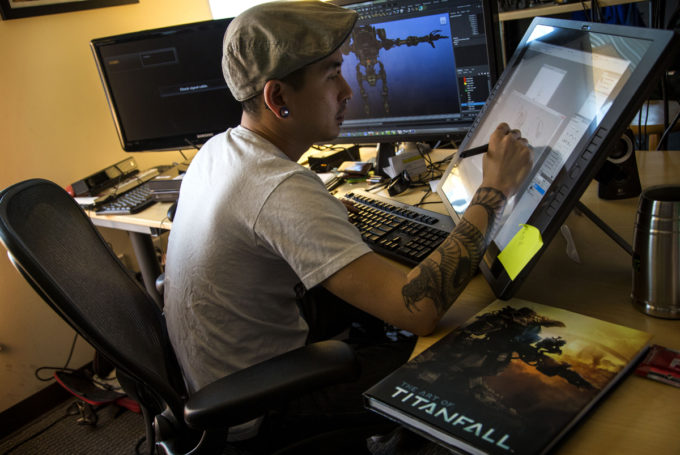 ***SUNDAY CALENDAR STORY FOR MARCH 9, 2014. DO NOT USE PRIOR TO PUBLICATION*** VAN NUYS, CA - FEBRUARY 27, 2014 - 3D artist William Cho working on new video game "Titanfall" at Respawn Entertainment video game development studio, Thursday, February 27, 2014. The studio is launching the new video game on March 11, 2014. (Ricardo DeAratanha/Los Angeles Times).