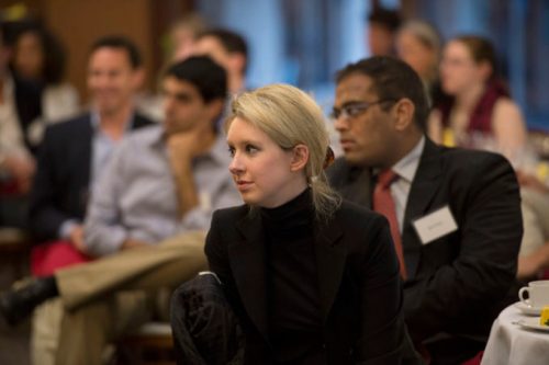 Elizabeth Holmes, the chief executive officer and founder of Theranos, a health care technology company, listens as Deputy Secretary of Defense Ash Carter speaks at Stanford University in Palo Alto, Calif., April 17, 2013. (DoD photo by Glenn Fawcett/Released)