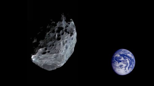 Un astéroïde et la Terre en arrière plan. // Source : Pixabay (photo recadrée)