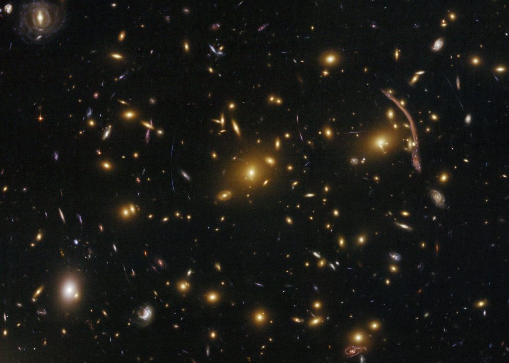 The Abell 370 galaxy cluster, photographed by the Hubble Space Telescope.  // Source: NASA