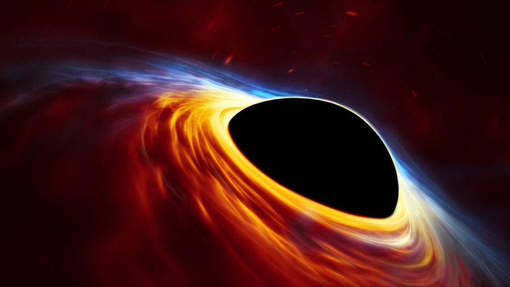 Un trou noir supermassif et son disque d'accrétion. // Source : ESO, ESA/Hubble, M. Kornmesser (photo recadrée)