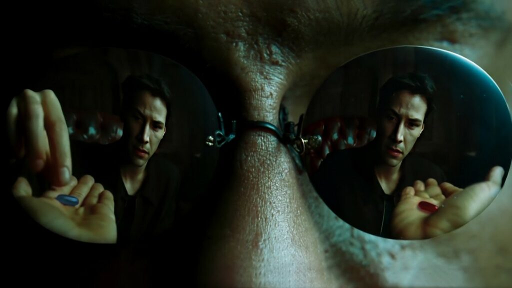 Dans Matrix, Neo prend la pilule rouge pour sortir de la matrice et commencer sa quête initiatique d'élu. // Source : The Matrix, film (1999)