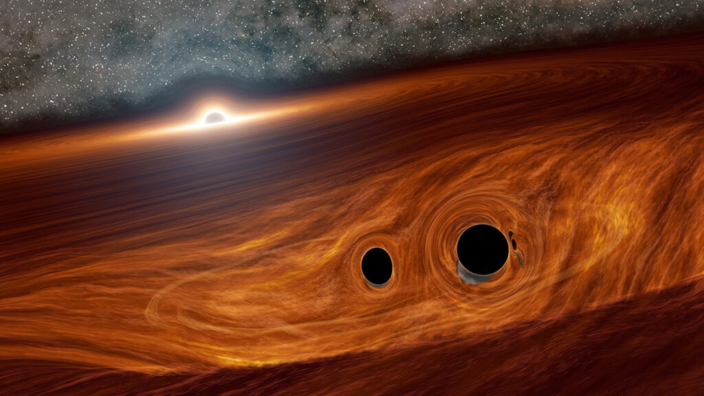 Deux trous noirs, dans le disque d'accrétion d'un trou noir supermassif. // Source : Caltech/R. Hurt (IPAC)