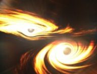 Vue d'artiste d'un trou noir binaire prêt à entrer en collision. // Source : Mark Myers, ARC Centre of Excellence for Gravitational Wave Discovery (OzGrav)
