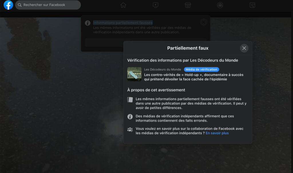 Une capture d'écran d'un partage de Hold Up sur Facebook Une capture d'écran d'un partage de Hold Up sur Facebook