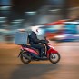 Motorcycle delivery.  // Source: Unsplash (cropped photo)