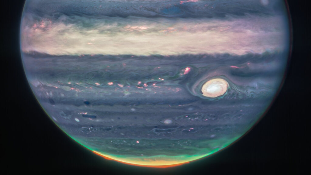 La Grande tache rouge et les aurores sur Jupiter. // Source : NASA, ESA, CSA, Jupiter ERS Team; image processing by Judy Schmidt.
