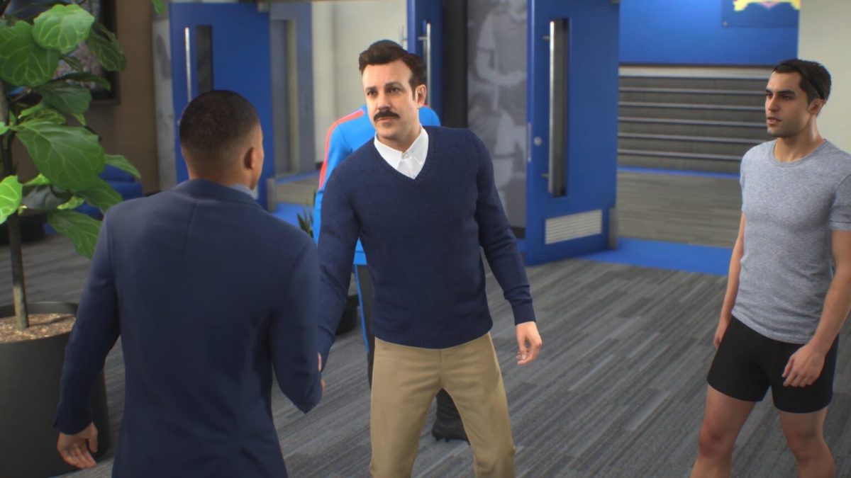 Ted Lasso accueille Kylian Mbappé dans FIFA 23, en compagnie de Jamie Tartt. // Source : Numerama