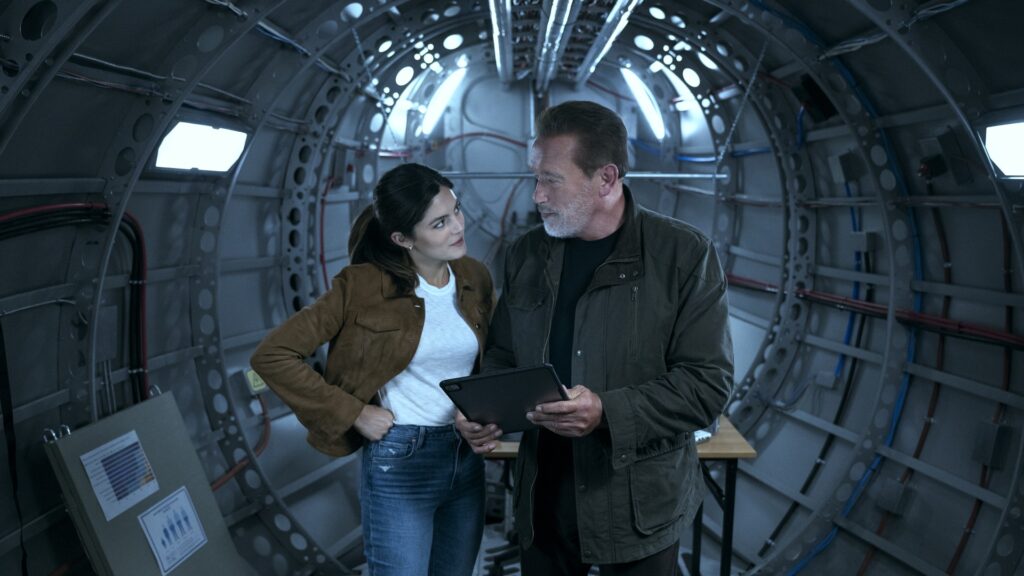 Arnold Schwarzenegger and Monica Barbaro are father and daughter in Fubar // Source: Christos Kalohoridis/Netflix