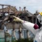 An IAEA inspector examining Unit 3 of the Fukushima nuclear power plant, shortly after the 2011 disaster. // Source: Greg Webb / IAEA