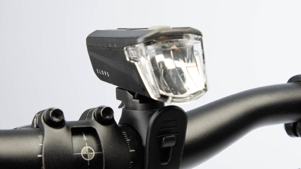 elops front light on bicycle handlebars