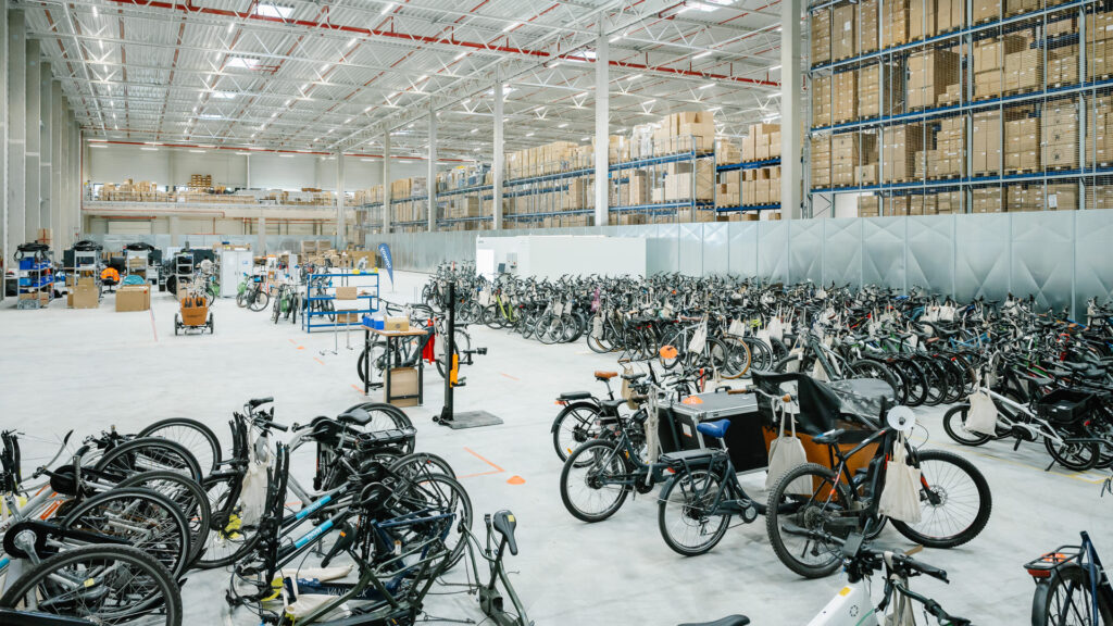 A large stock of reconditioned bicycles.  // Source: Upway