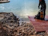 Quai de la poudrière Milhaud (XVIIe siècle) en cours de fouille subaquatique après son dégagement des remblais des années 1930 qui ont reliés l'île à la terre. // Source : Flore Giraud, Inrap