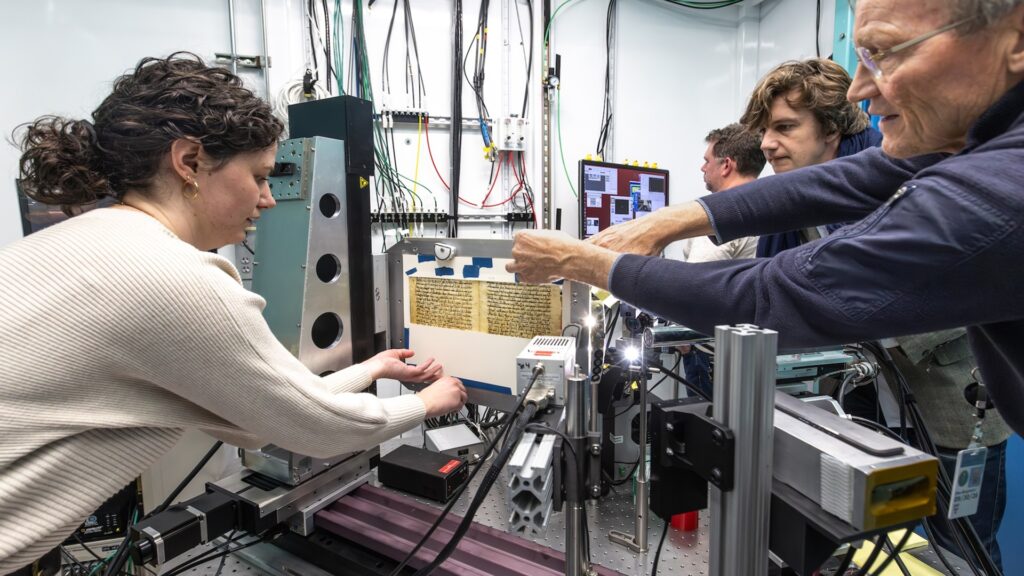 Conservation technician Elizabeth Hayslett (left) and University of Wisconsin-Madison professor Uwe Bergmann arrange a portion of the Codex Climaci rescriptus palimpsest, from the Museum of the Bible in Washington, DC. The pages were brought to SLAC National Accelerator Laboratory to have x-ray fluorescence imaging done at SSRL beamline 7-2 to recover the erased astronomical text, especially fragments from Hipparchus's star catalogue. (Jacqueline Ramseyer Orrell/SLAC National Accelerator Laboratory)