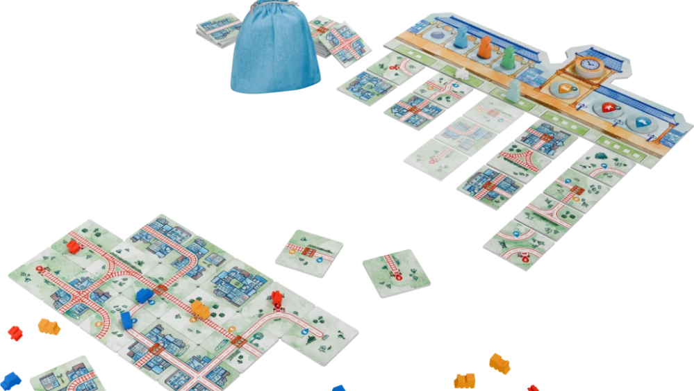 Une partie en cours, avec une ville en bas et les lots de tuiles en haut. // Source : Iello