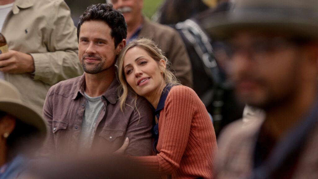 Virgin River S7. (L to R) Benjamin Hollingsworth as Dan Brady and Zibby Allen as Brie Sheridan in Episode #710 of Virgin River S7. Cr. Courtesy of Netflix &copy; 2025