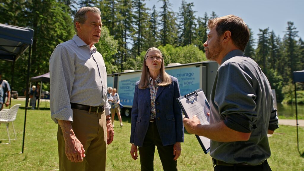 Virgin River S7. (L to R) Tim Matheson as Dr. Vernon Mullins, Annette O'Toole as Hope McCrea and Kaj-Erik Eriksen as Dr. Hayes in Episode #709 of Virgin River S7. Cr. Courtesy of Netflix &copy; 2025