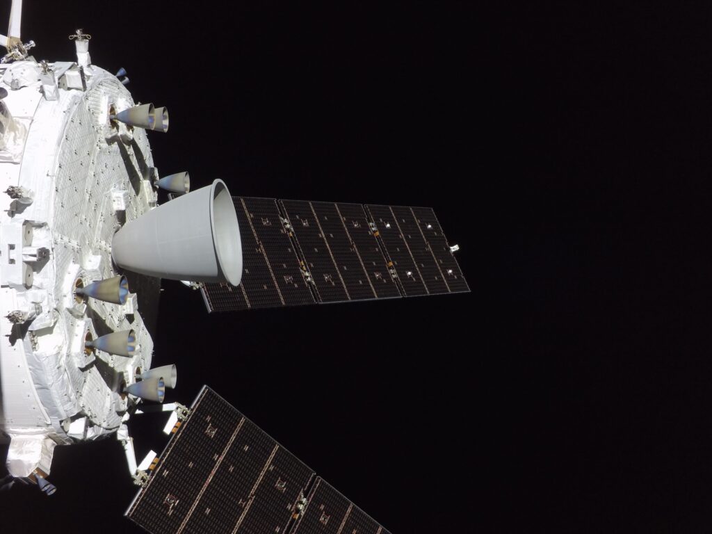 art002e012495 (April 7, 2026) - The engines on the Orion spacecraft&rsquo;s service module are prominently featured in this image from flight day six of the Artemis II mission. Taken from a camera mounted on a solar array wing, the largest is the orbital maneuvering system engine, surrounded by eight smaller auxiliary thrusters. Credit: NASA